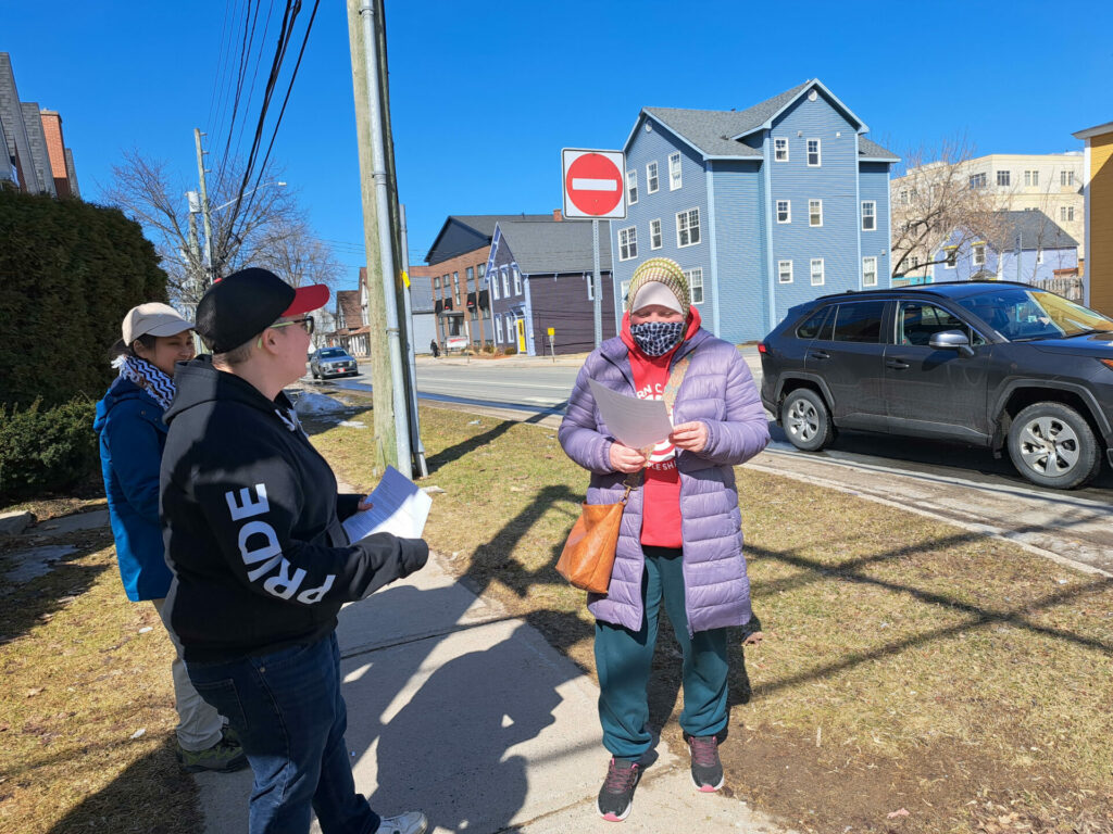 ACORN member reading our demands