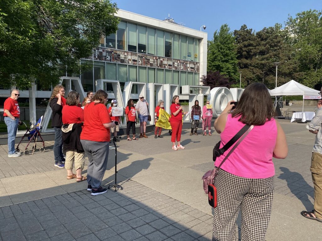 ACORN members participating in the Fair Fares rally in front of City Hall.