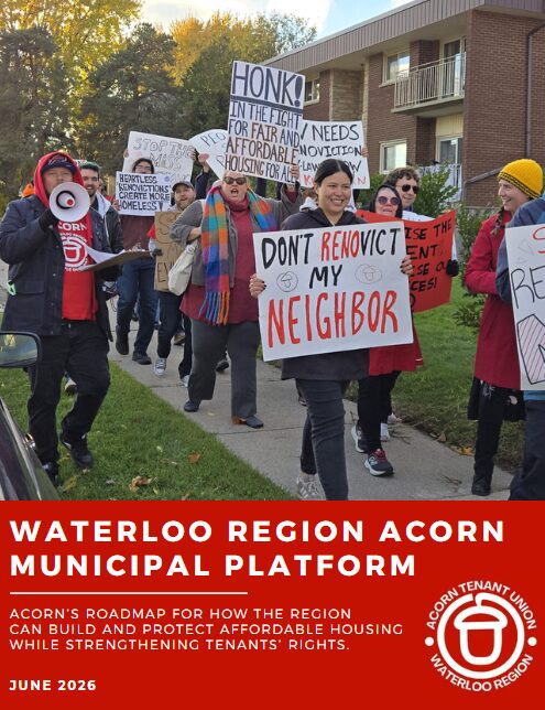 Protesters march along a sidewalk carrying signs about housing justice; the foreground sign reads 'Don't Evict My Neighbor.' A red banner at the bottom advertises the Waterloo Region Acorn Municipal Platform with a tenants' rights logo.