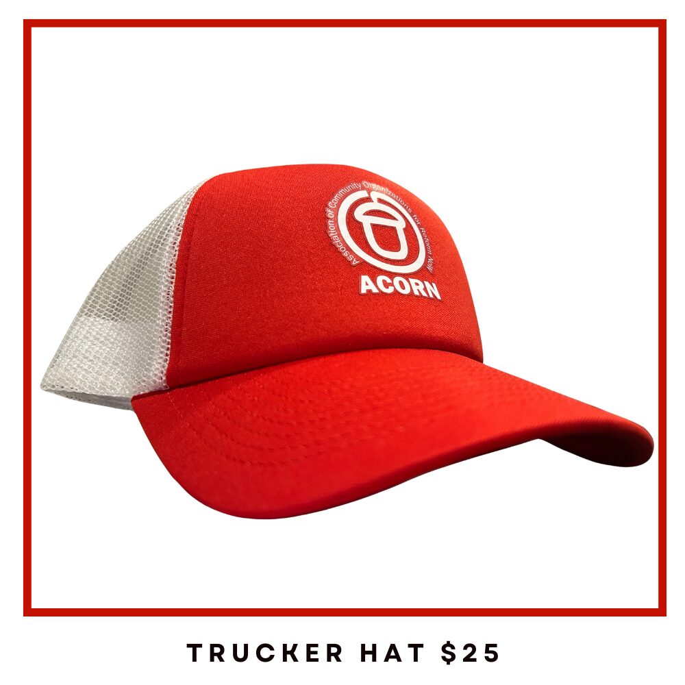 Red trucker hat with a red front panel, white mesh back, and an Acorn logo on the front; product photo.